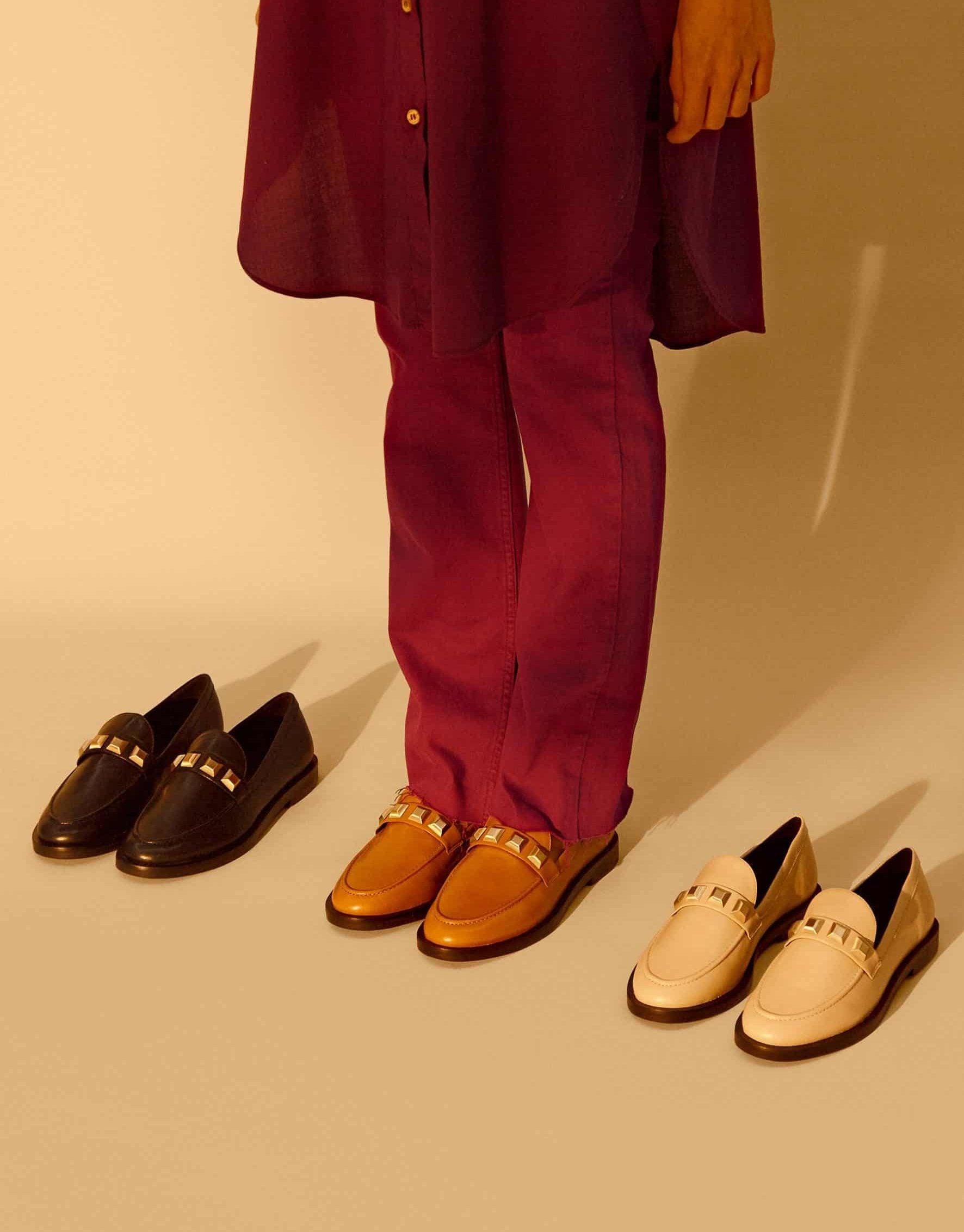 A pair of Mangará Women's Loafers Caete Leather showcasing premium goat leather, round toe design, and stylish metal studs.