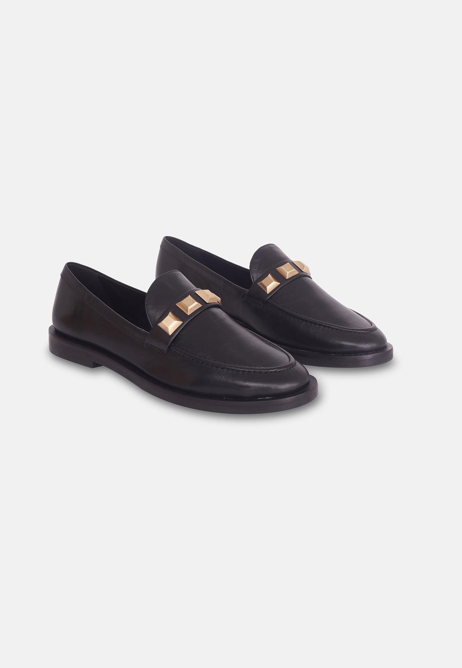 A pair of Mangará Women's Loafers Caete Leather showcasing premium goat leather, round toe design, and stylish metal studs.