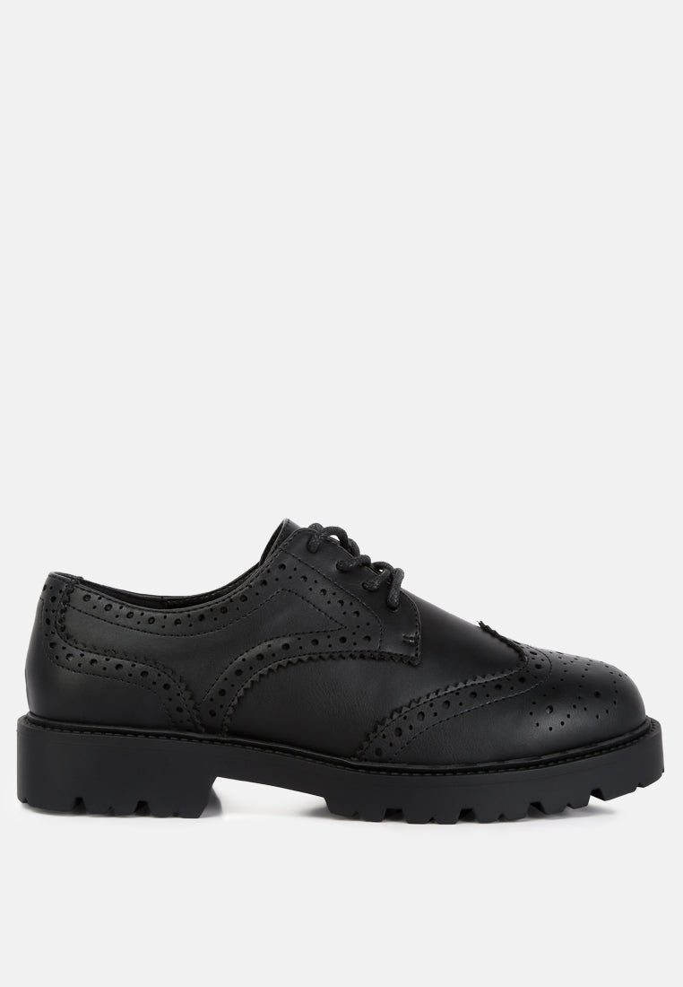 Milou Lug Sole Derby Shoes featuring faux leather upper, lace-up design, and unique perforated detailing.