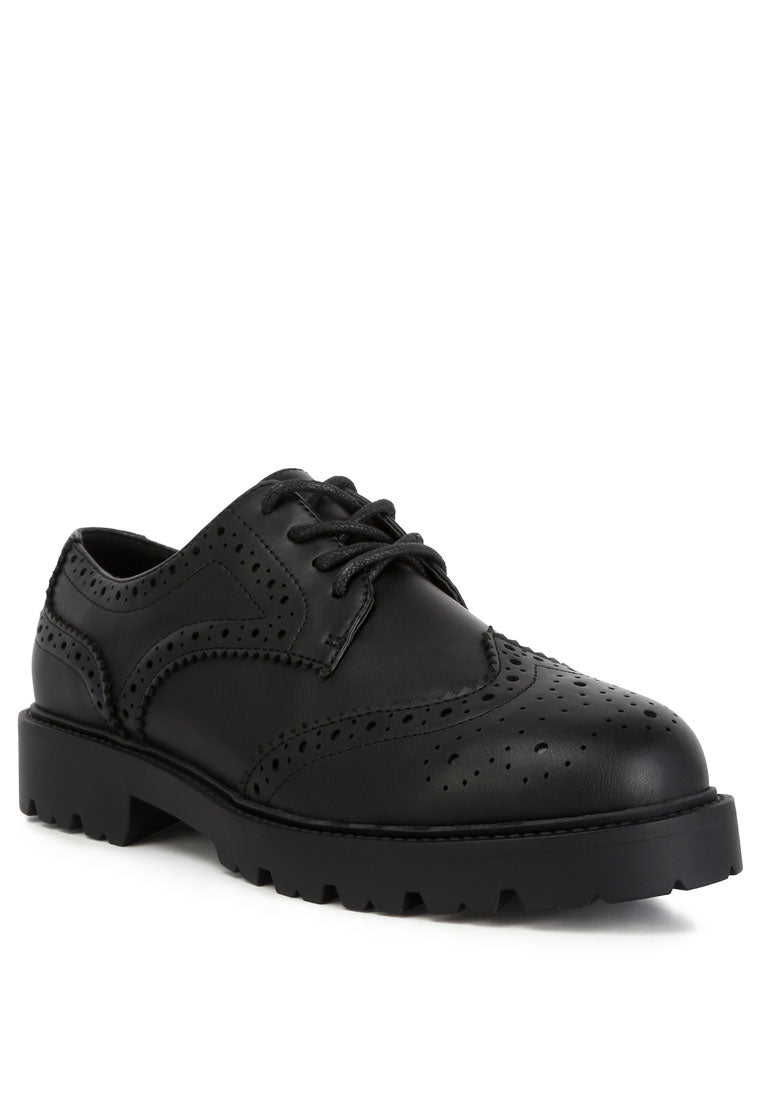 Milou Lug Sole Derby Shoes featuring faux leather upper, lace-up design, and unique perforated detailing.