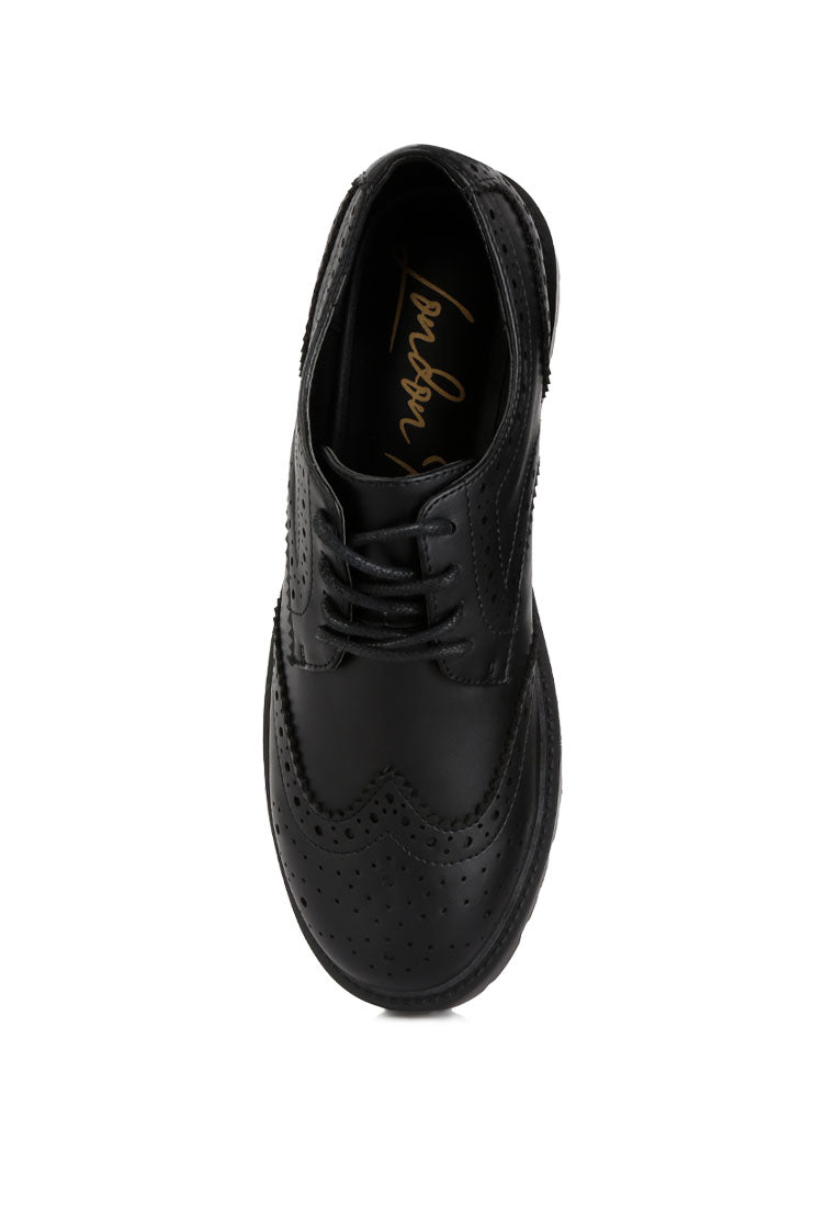 Milou Lug Sole Derby Shoes featuring faux leather upper, lace-up design, and unique perforated detailing.