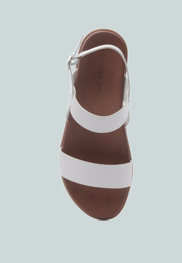 Miya Slingback Flat Sandals in stylish faux leather, perfect for casual outings and beach days.