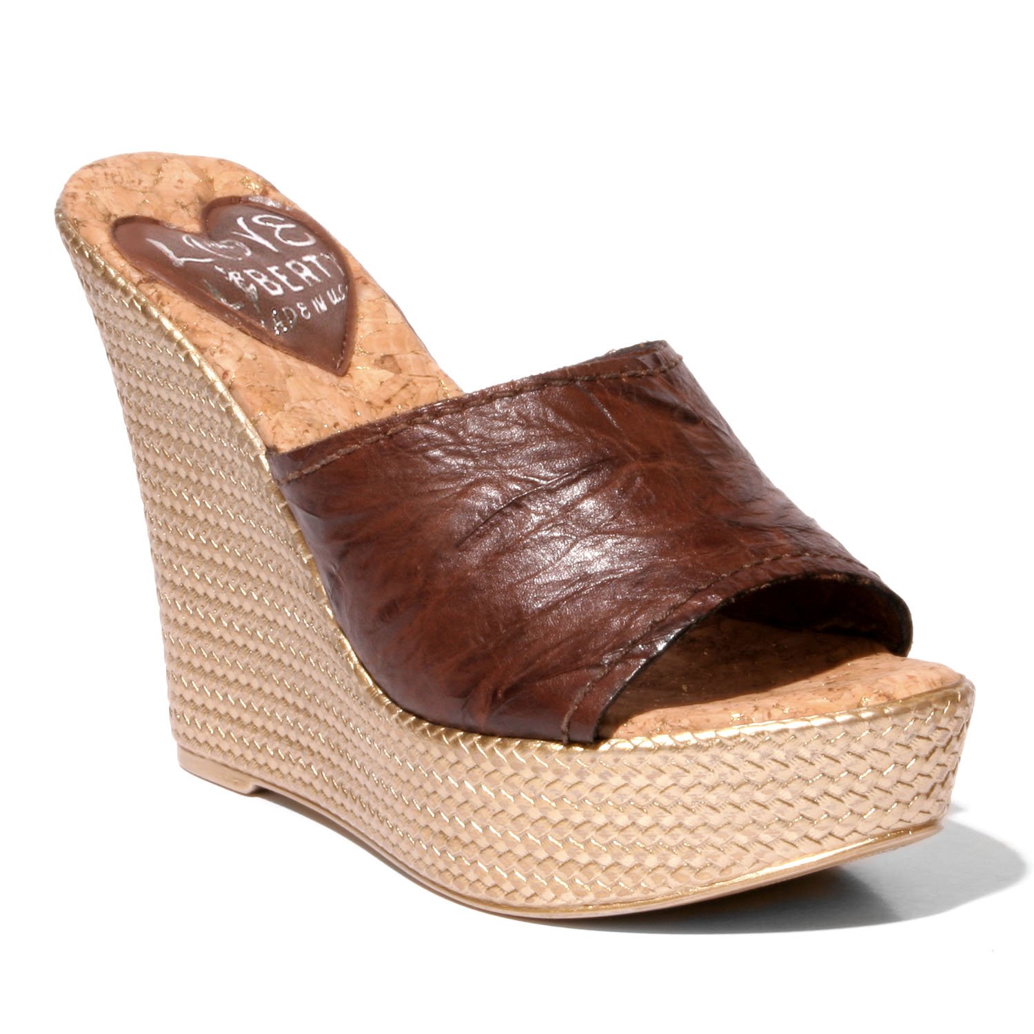 Stylish Ms. Independent hip wedge sandals with crinkle leather upper and snake print sock.