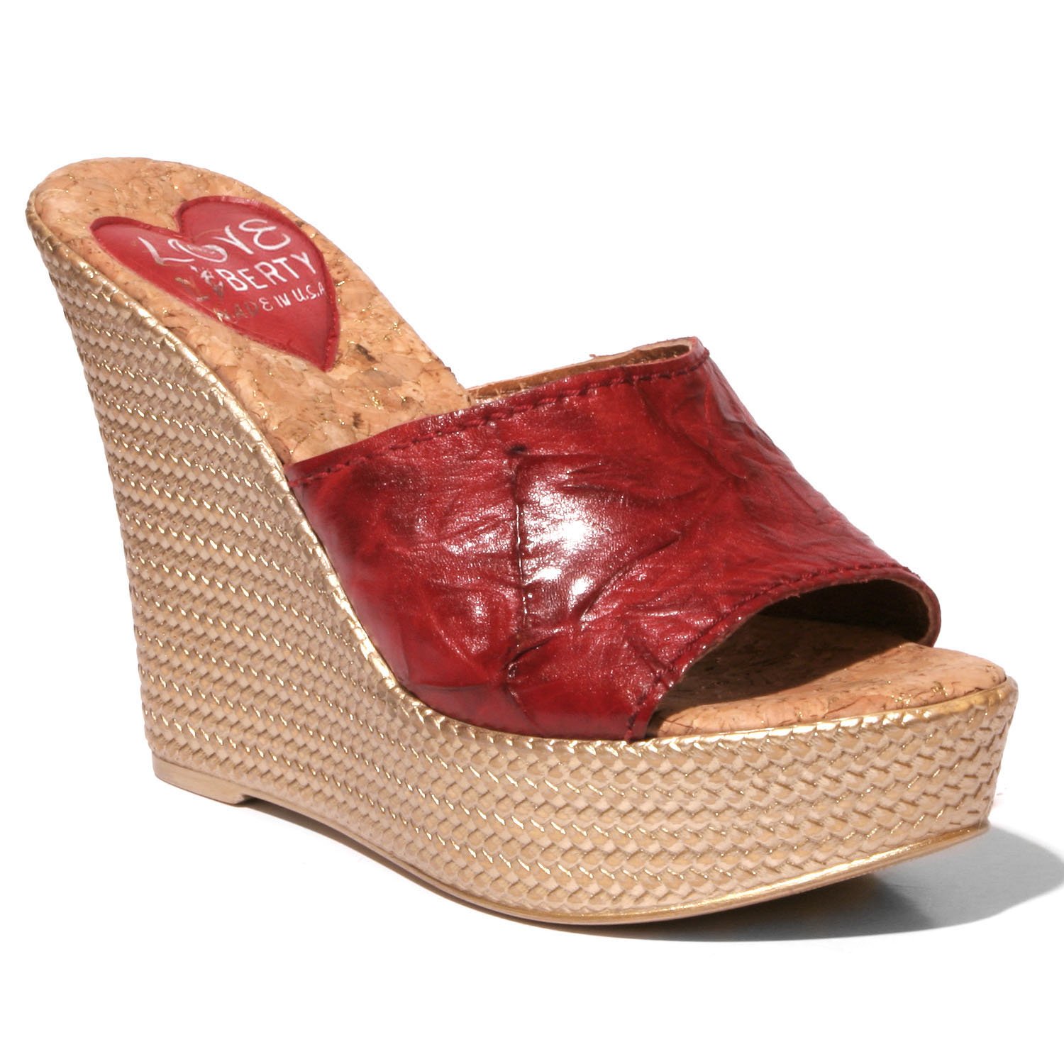 Stylish Ms. Independent hip wedge sandals with crinkle leather upper and snake print sock.