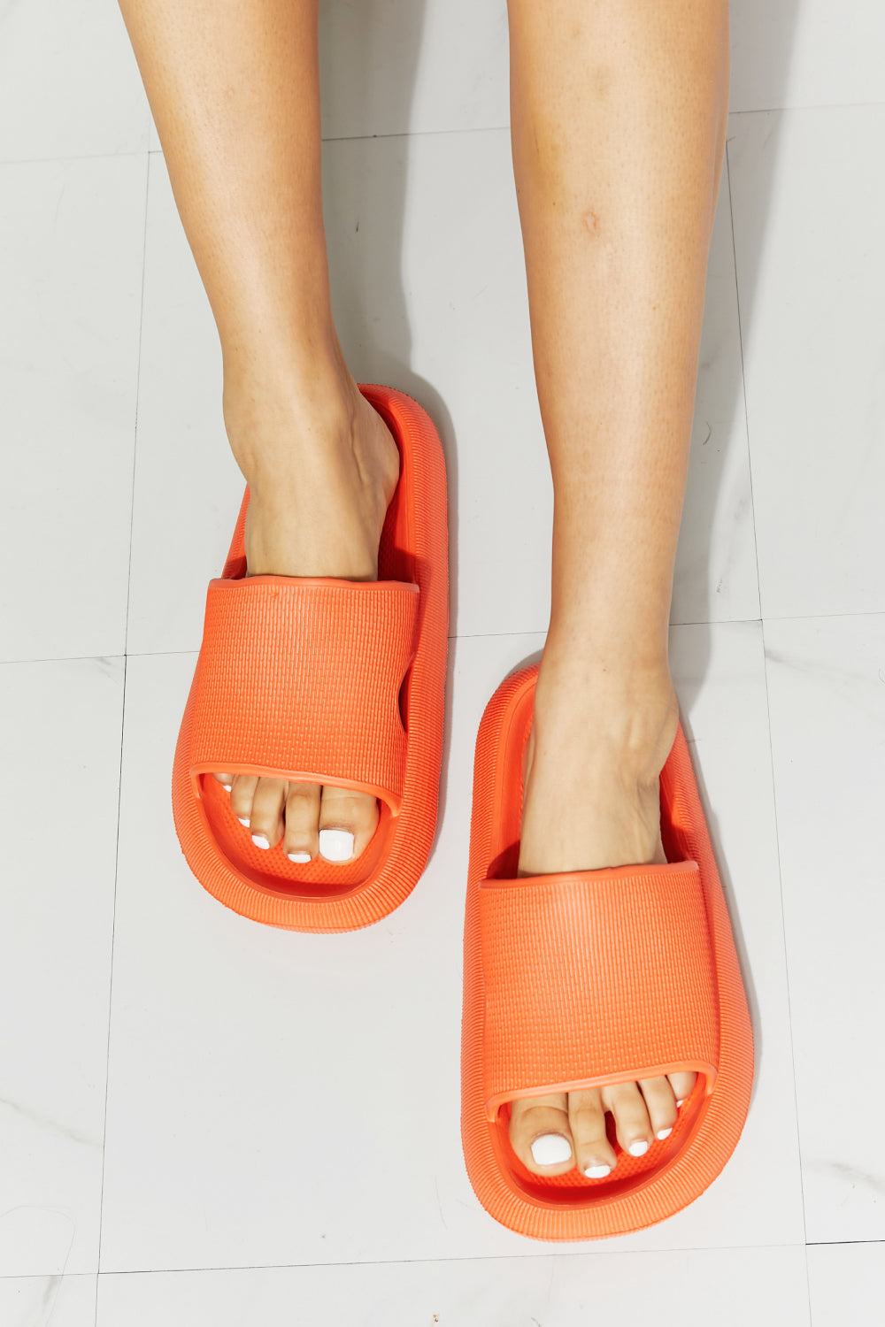 MMShoes Arms Around Me Open Toe Slide in vibrant orange, showcasing a comfortable rubber design perfect for casual wear.