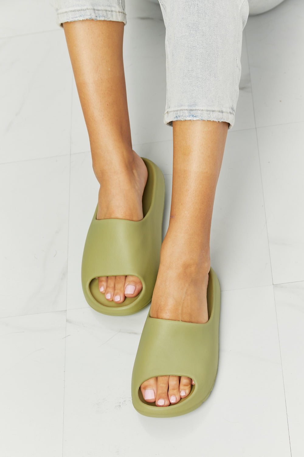 NOOK JOI In My Comfort Zone Slides in vibrant green color with a durable rubber sole, showcasing an open toe design for casual wear.