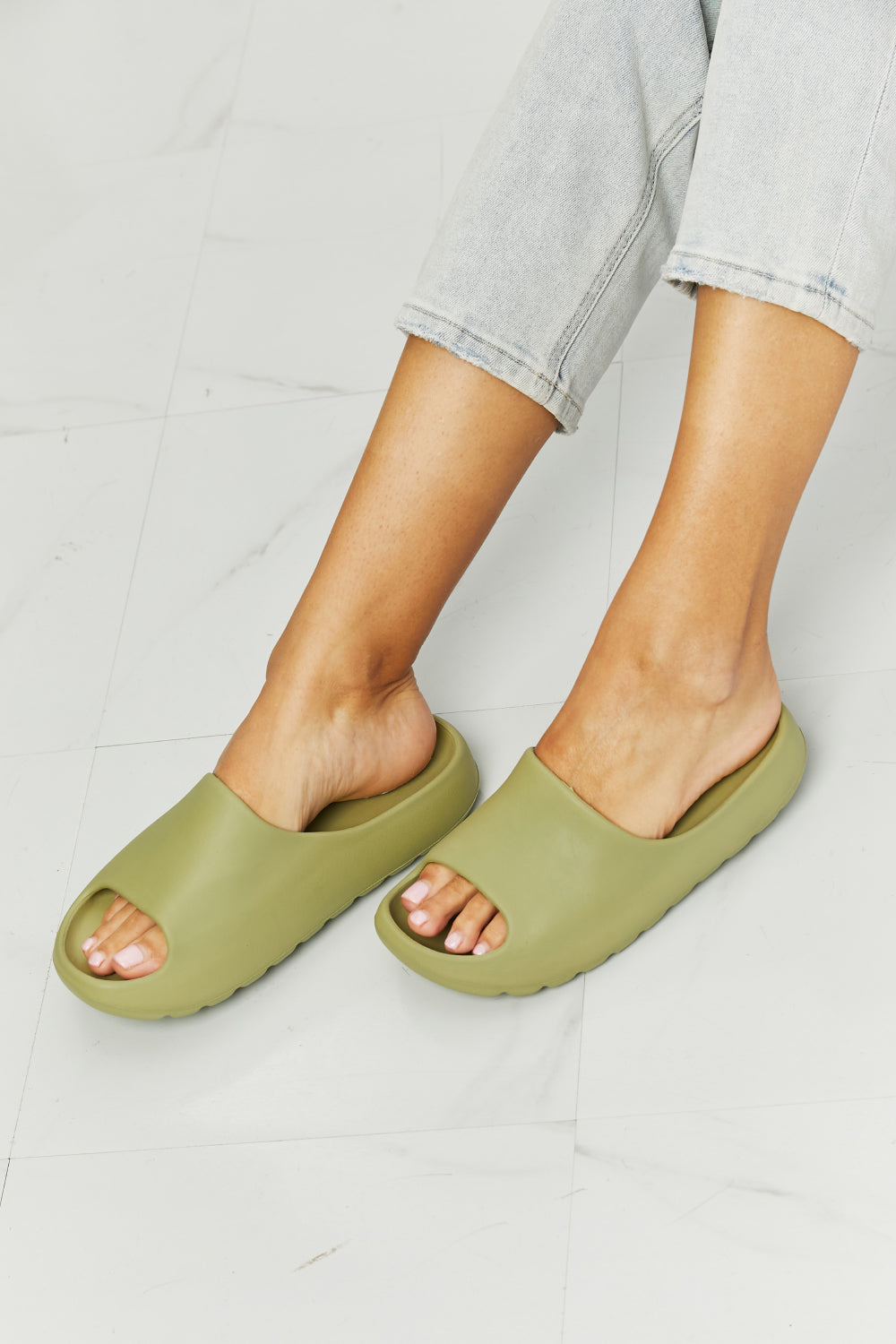 NOOK JOI In My Comfort Zone Slides in vibrant green color with a durable rubber sole, showcasing an open toe design for casual wear.