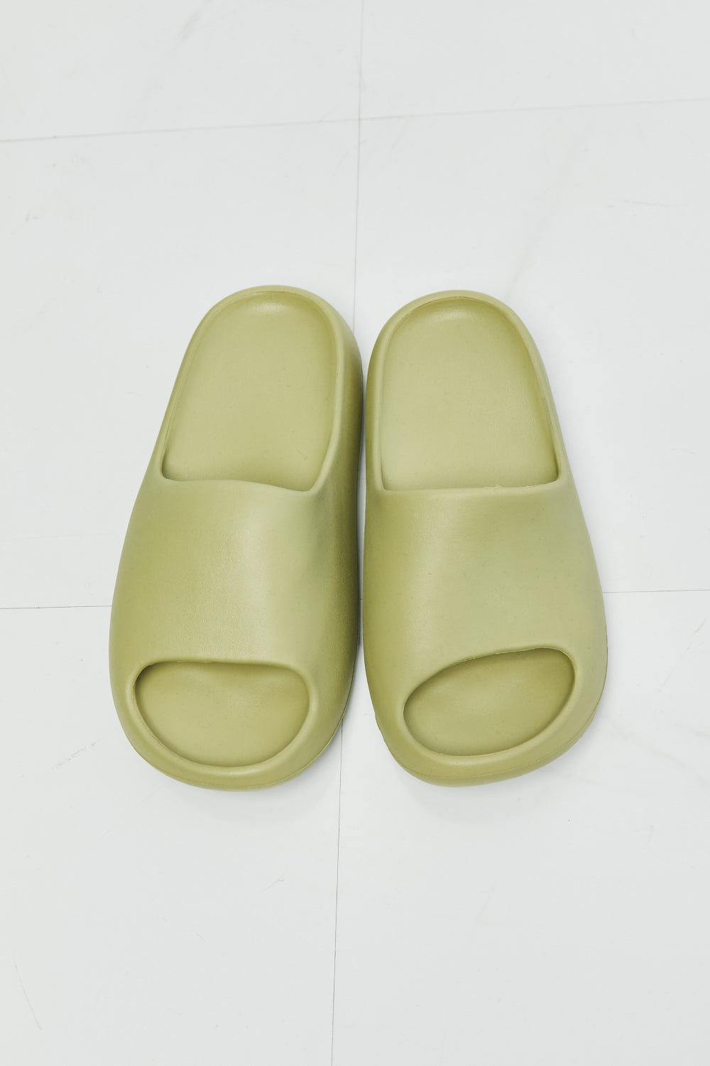 NOOK JOI In My Comfort Zone Slides in vibrant green color with a durable rubber sole, showcasing an open toe design for casual wear.