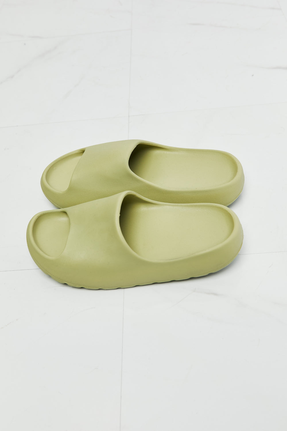 NOOK JOI In My Comfort Zone Slides in vibrant green color with a durable rubber sole, showcasing an open toe design for casual wear.