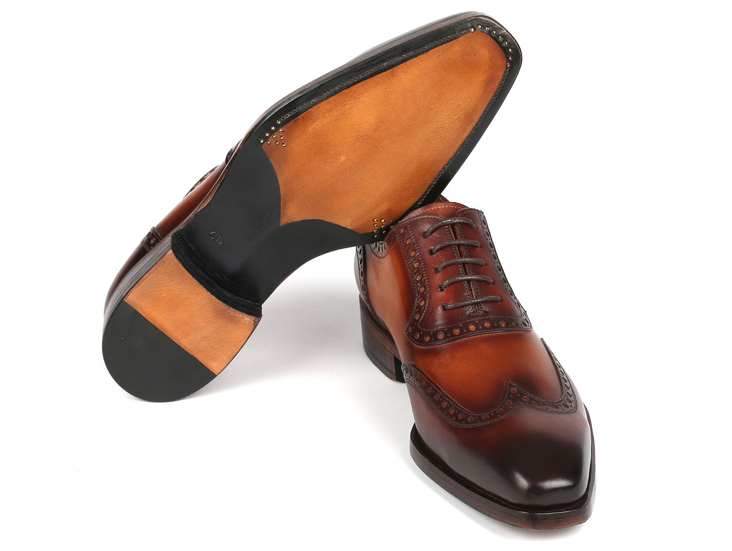 Paul Parkman Goodyear Welted Men's Wingtip Oxfords in brown leather, showcasing intricate craftsmanship and elegant design.