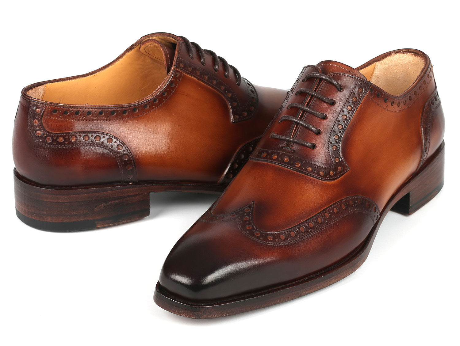 Paul Parkman Goodyear Welted Men's Wingtip Oxfords in brown leather, showcasing intricate craftsmanship and elegant design.