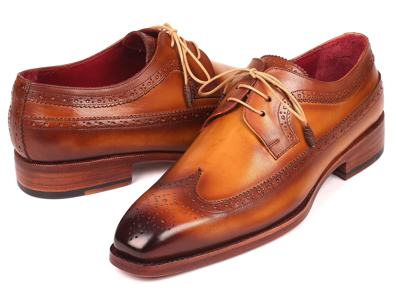 Paul Parkman Goodyear welted wingtip derby shoes in camel color, showcasing hand-painted calfskin leather and elegant wingtip design.