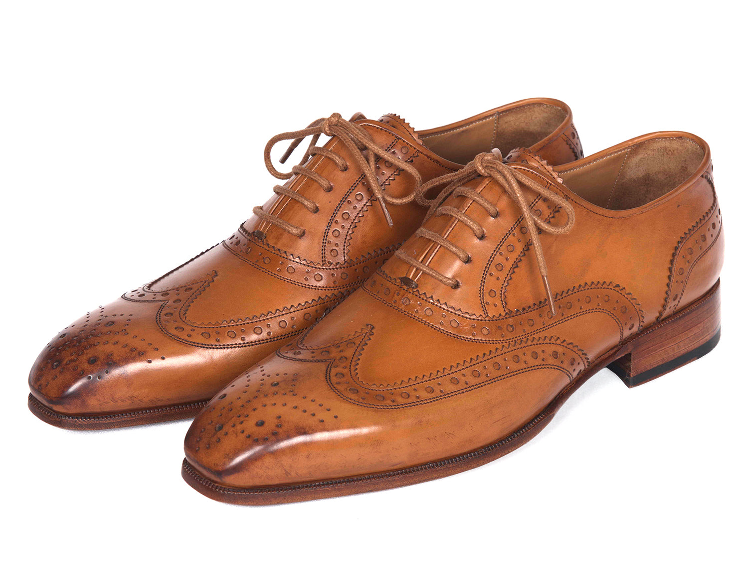 Paul Parkman Wingtip Oxfords in Cognac, featuring hand-burnished leather upper and antiqued leather sole, showcasing elegant brogue detailing.