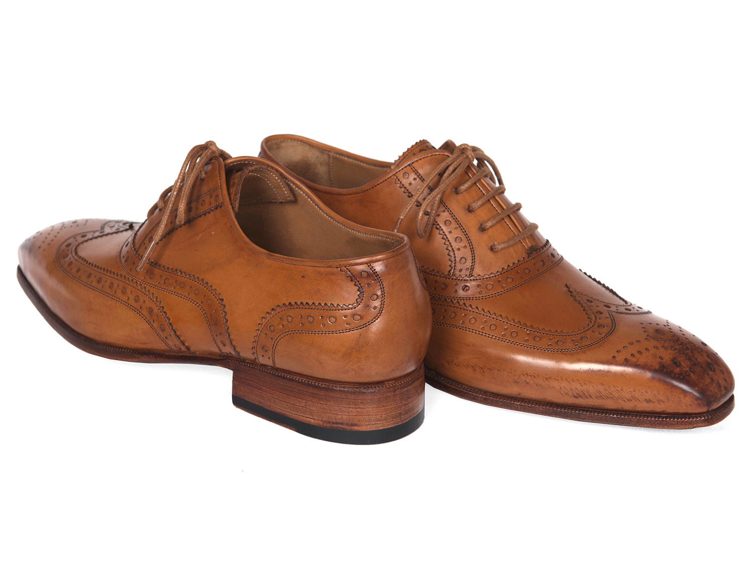 Paul Parkman Wingtip Oxfords in Cognac, featuring hand-burnished leather upper and antiqued leather sole, showcasing elegant brogue detailing.