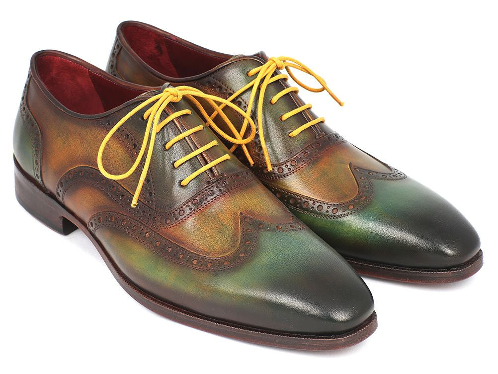 Paul Parkman Wingtip Oxfords in green hand-painted calfskin with bordeaux sole and yellow laces, showcasing unique craftsmanship.