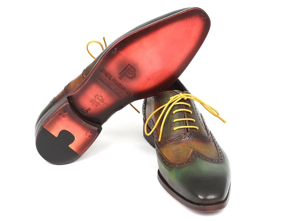 Paul Parkman Wingtip Oxfords in green hand-painted calfskin with bordeaux sole and yellow laces, showcasing unique craftsmanship.