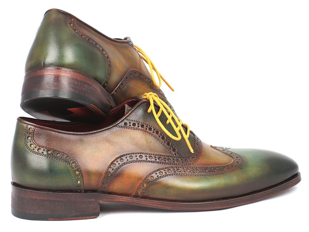 Paul Parkman Wingtip Oxfords in green hand-painted calfskin with bordeaux sole and yellow laces, showcasing unique craftsmanship.