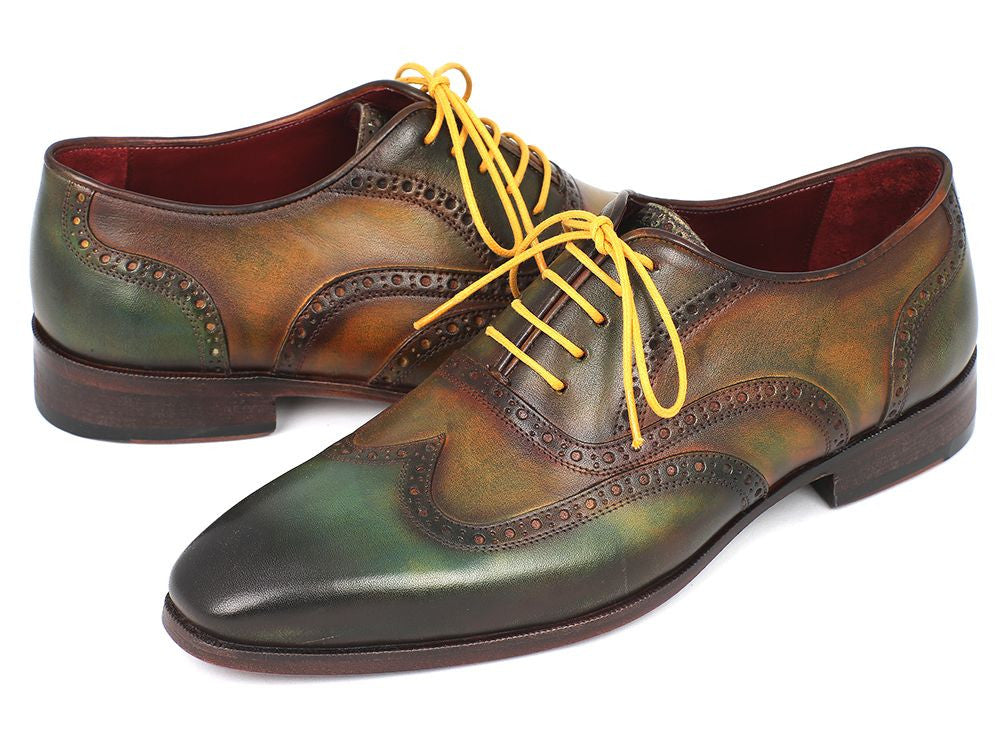 Paul Parkman Wingtip Oxfords in green hand-painted calfskin with bordeaux sole and yellow laces, showcasing unique craftsmanship.