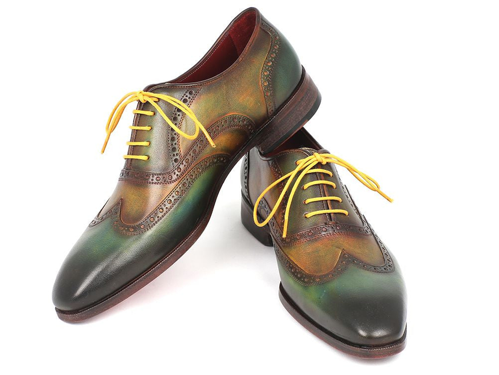 Paul Parkman Wingtip Oxfords in green hand-painted calfskin with bordeaux sole and yellow laces, showcasing unique craftsmanship.