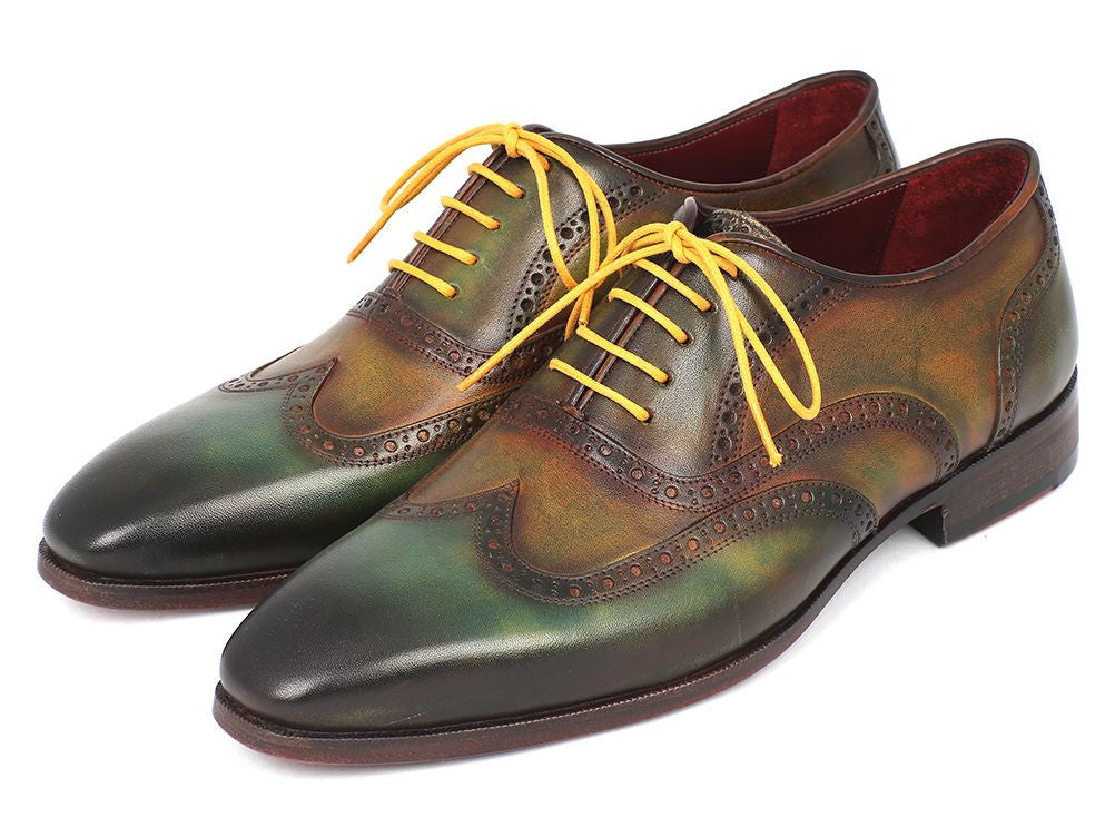 Paul Parkman Wingtip Oxfords in green hand-painted calfskin with bordeaux sole and yellow laces, showcasing unique craftsmanship.