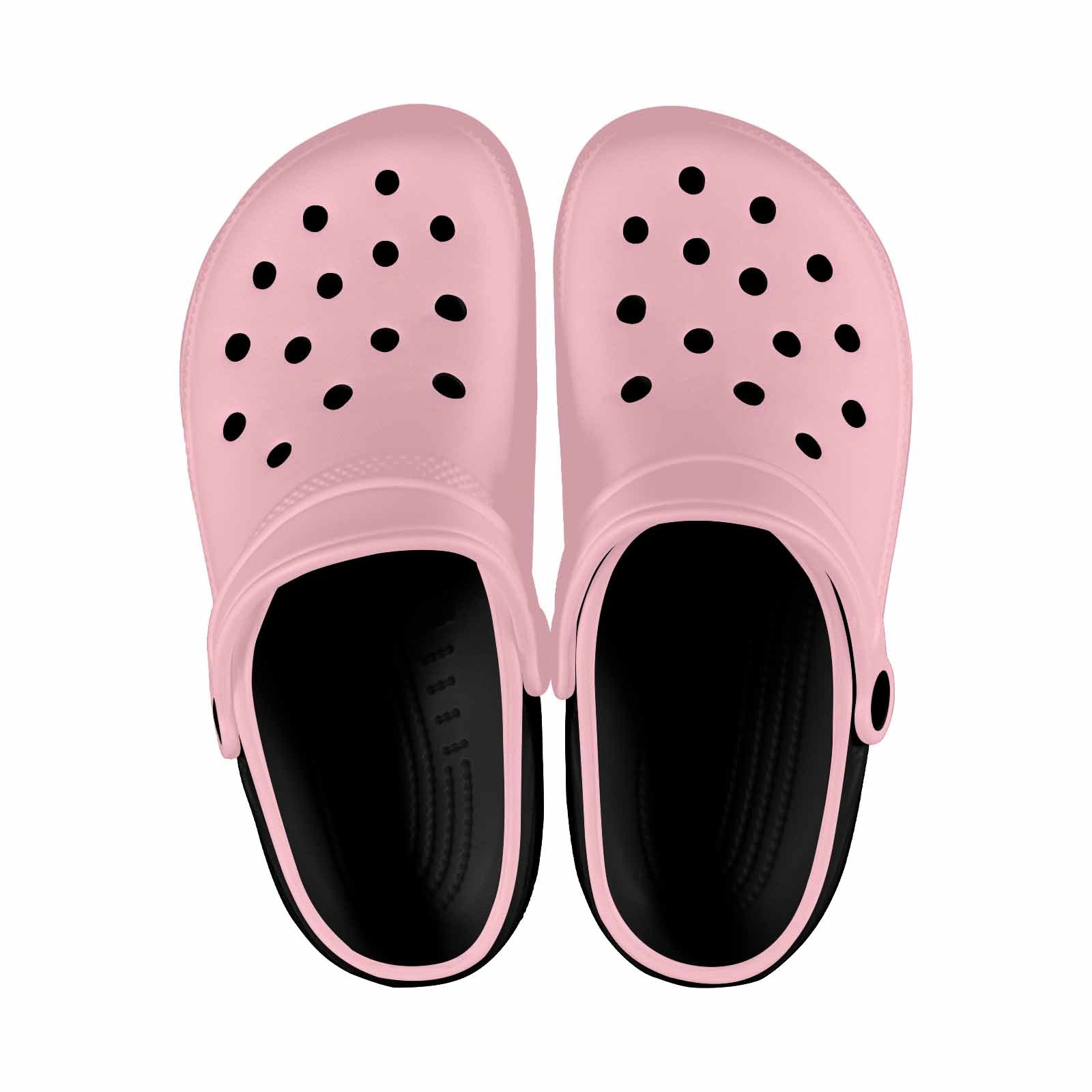 A pair of pink adult clogs made from lightweight EVA material, featuring ventilation ports and pivoting heel straps for a secure fit.