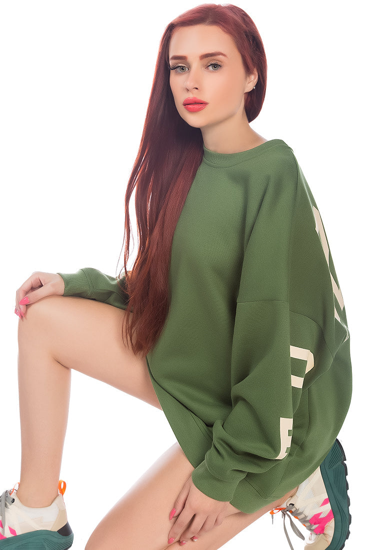 A cozy printed oversized sweatshirt featuring full sleeves and a crewneck design, perfect for casual wear and indoor gatherings.