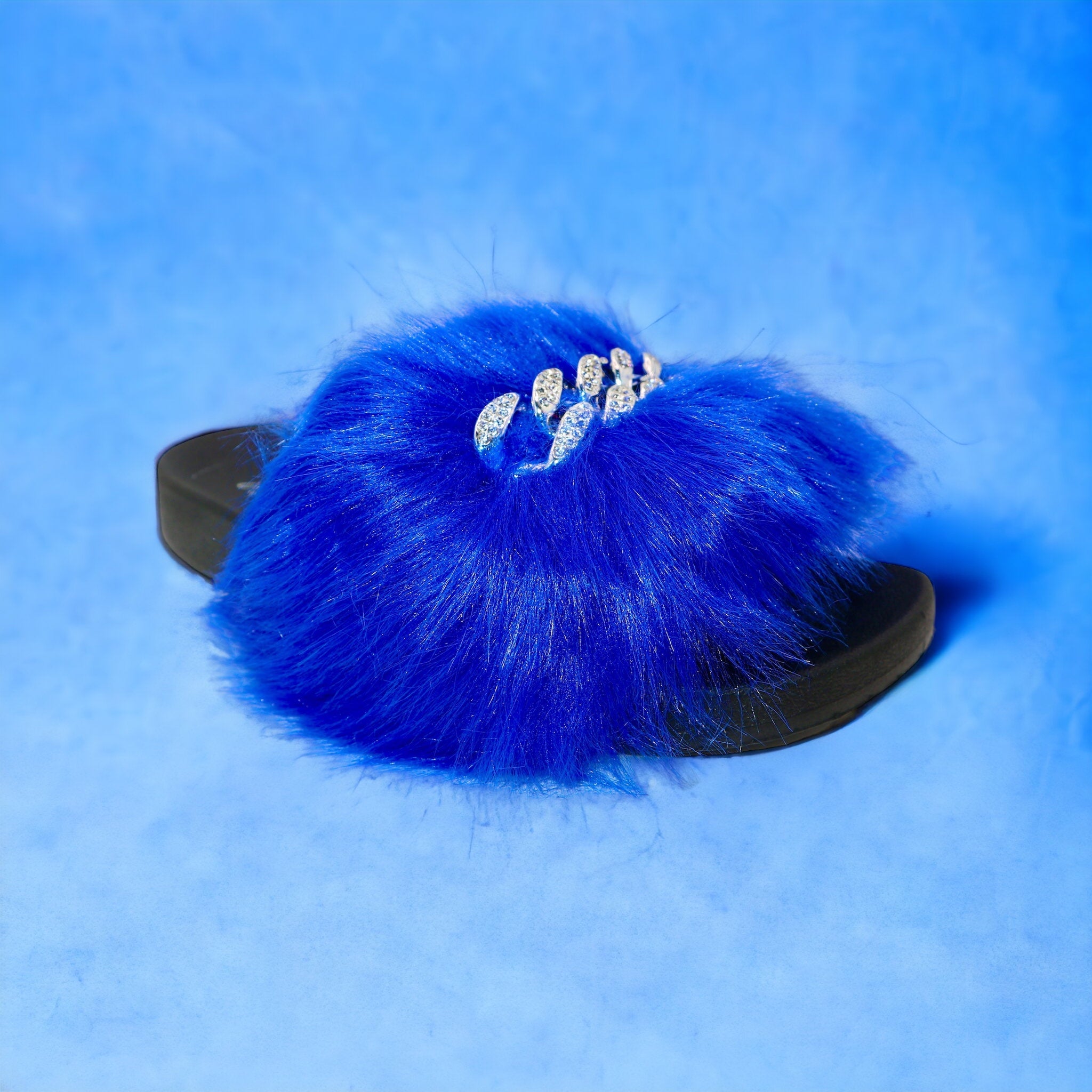 Pupa Slippers Blue showcasing a stylish slip-on design with elastic side panels, perfect for comfort and versatility.