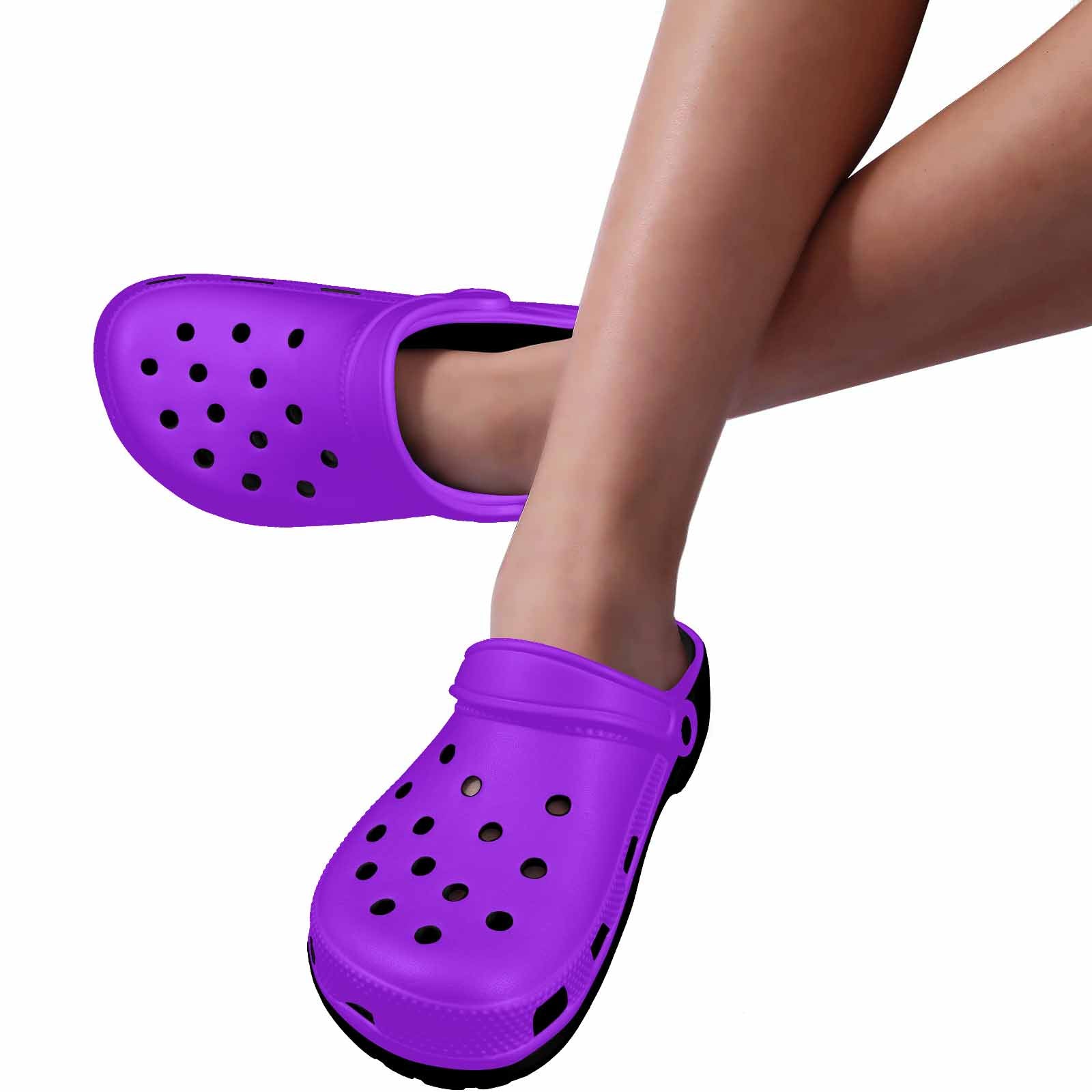 Purple adult clogs made from lightweight EVA material with ventilation ports and pivoting heel straps.