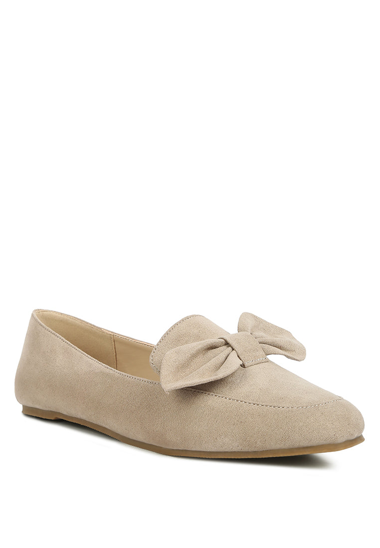 Stylish Remee Front Bow Loafers featuring a chic bow design, flat heel, and round toe, perfect for casual and formal wear.