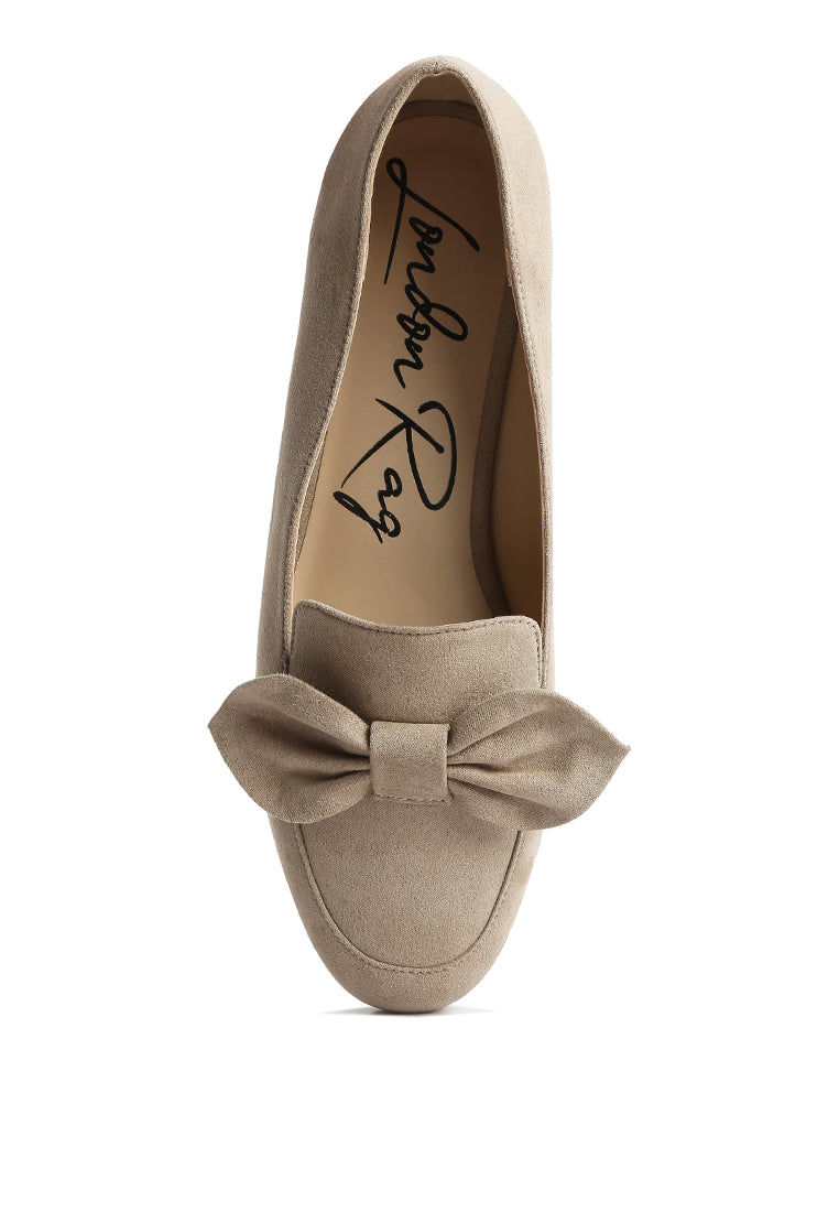 Stylish Remee Front Bow Loafers featuring a chic bow design, flat heel, and round toe, perfect for casual and formal wear.