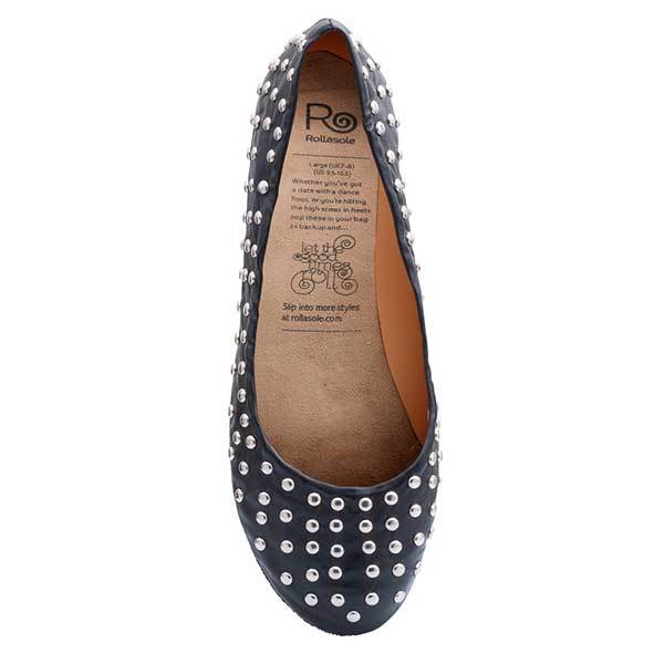 A pair of stylish black studded deluxe Rollasoles in a high heel carry bag, showcasing their chic design and practicality.