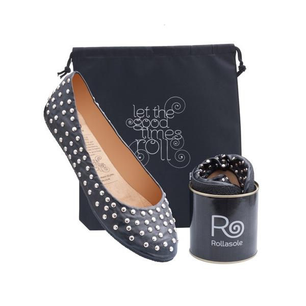 A pair of stylish black studded deluxe Rollasoles in a high heel carry bag, showcasing their chic design and practicality.