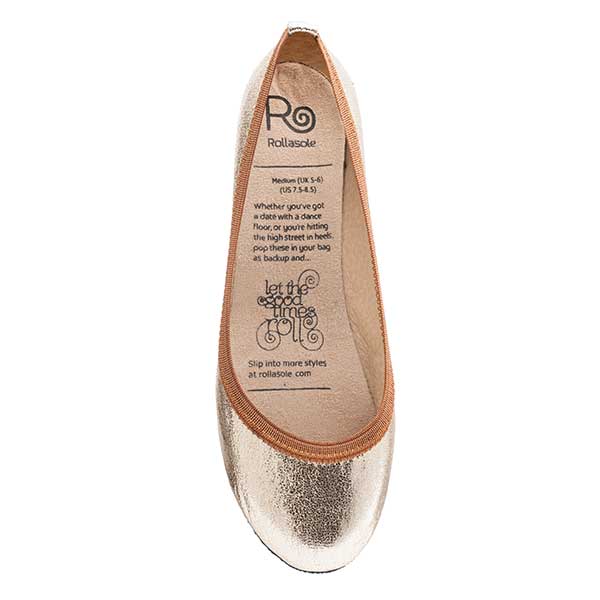 Rosie Gold Rollasoles in bronze and gold, featuring a luxurious sole and a stylish carry bag.