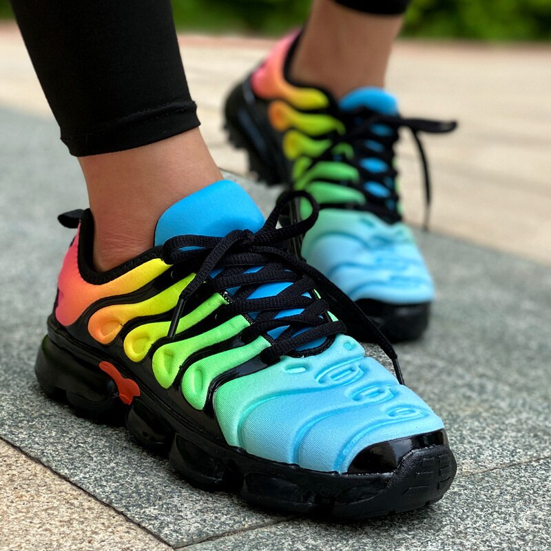 A pair of stylish women's running training fitness sneakers designed for summer sports, featuring a breathable mesh upper and cushioned sole.