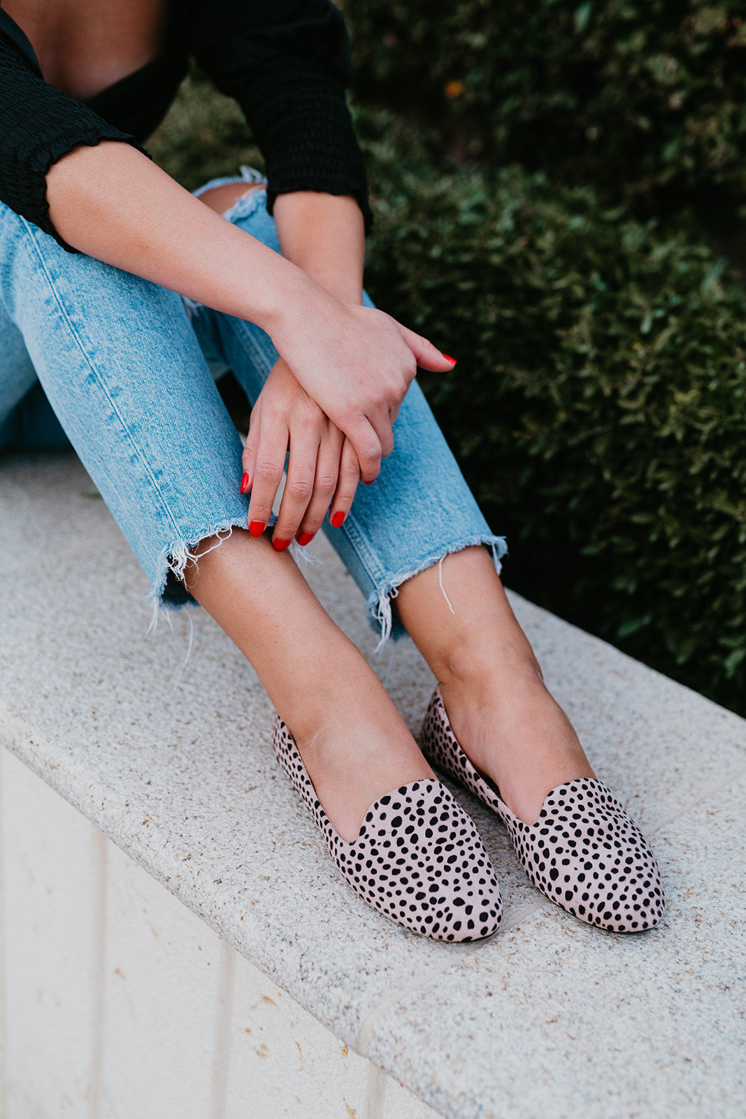 Savannah cheetah flats displayed with a stylish high heel carry bag, showcasing their trendy design and foldable feature.