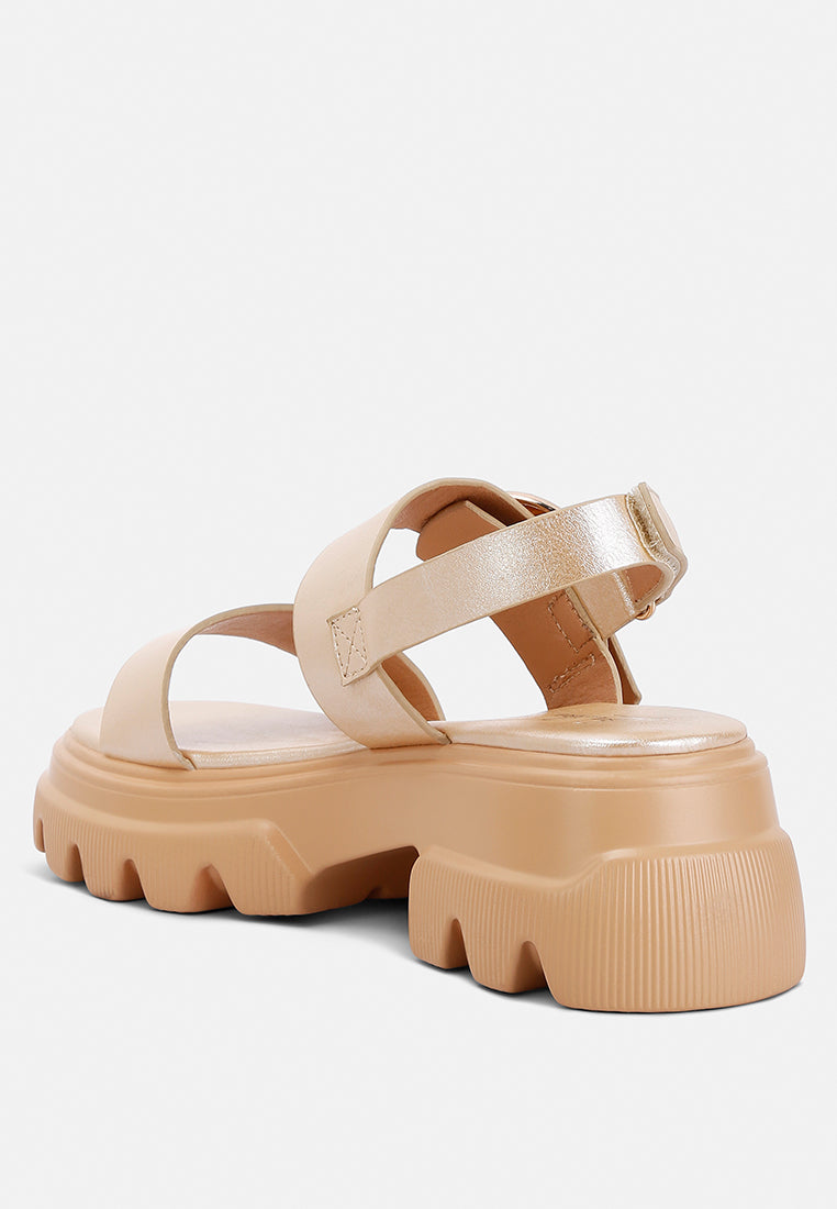 Silas Metallic Chunky Sandals featuring a rugged lug sole and glamorous metallic finish, designed for comfort and style.