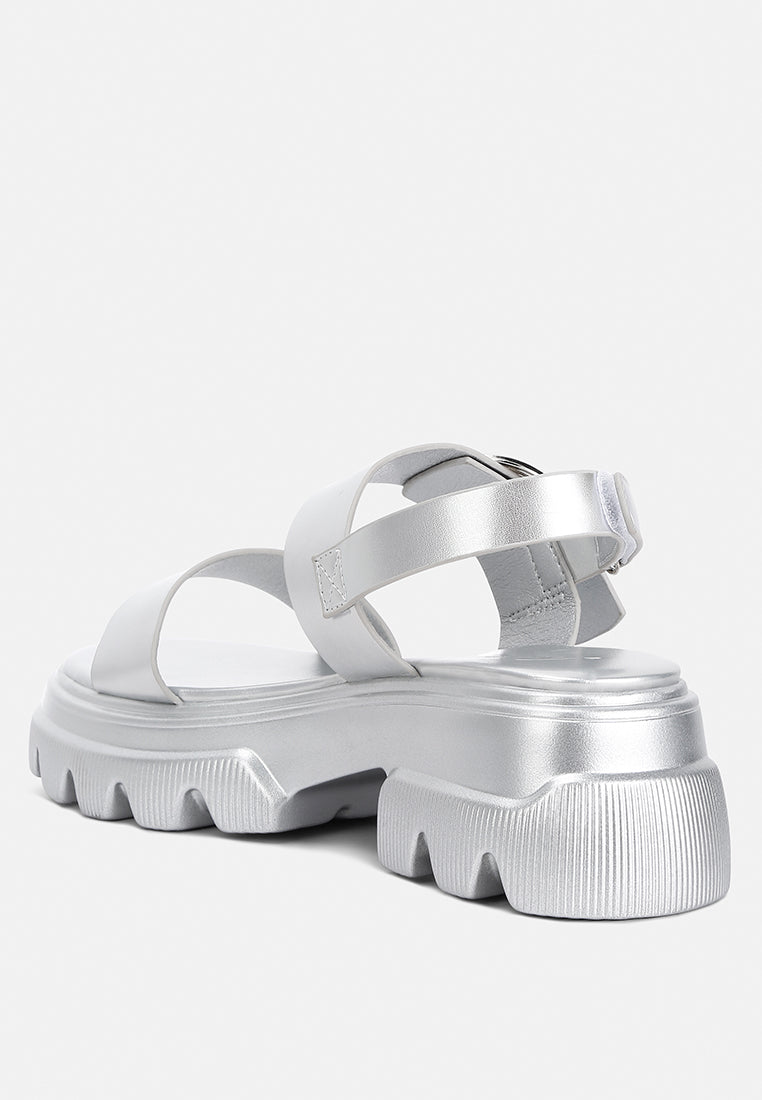 Silas Metallic Chunky Sandals featuring a rugged lug sole and glamorous metallic finish, designed for comfort and style.