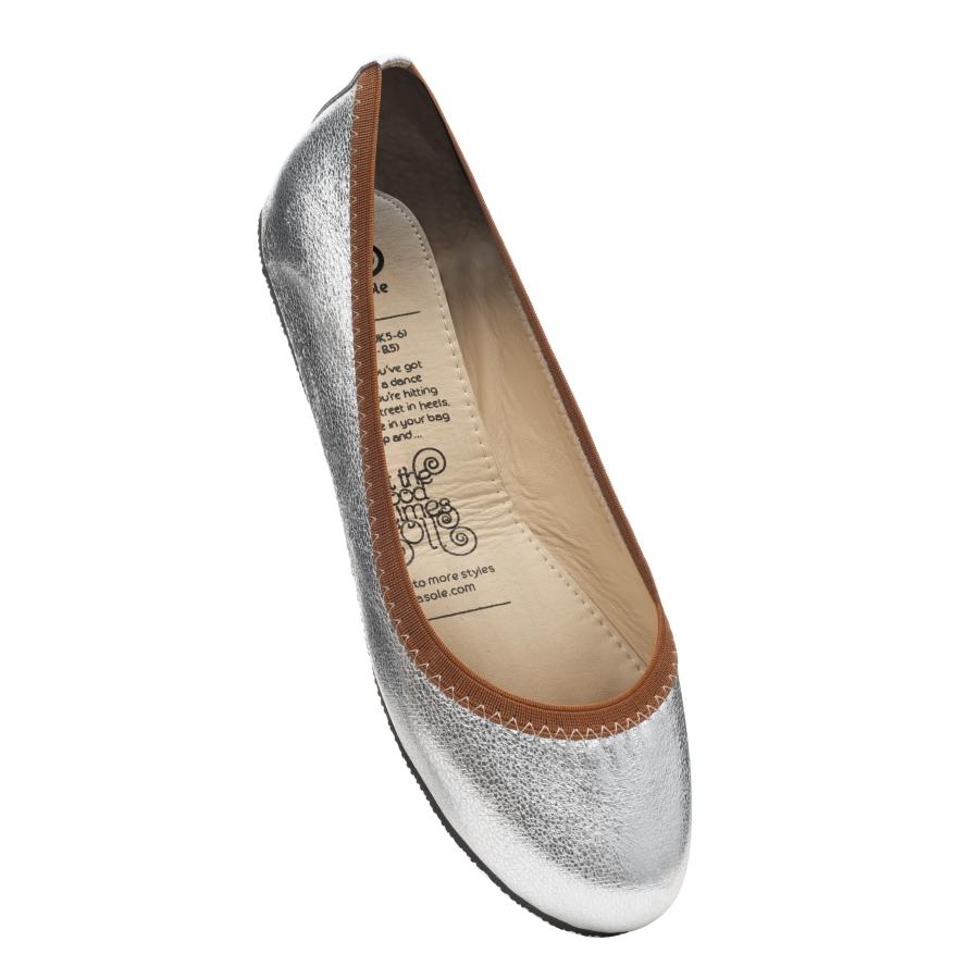 Stylish silver ballet pumps with dark tan trim, perfect for versatile fashion.