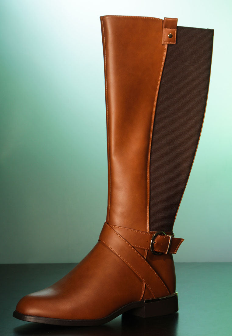 Stylish Snowd Riding Boot featuring dual tones, metallic buckle belt embellishment, and knee-high design.