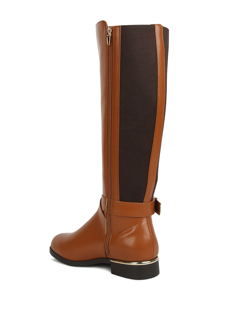 Stylish Snowd Riding Boot featuring dual tones, metallic buckle belt embellishment, and knee-high design.