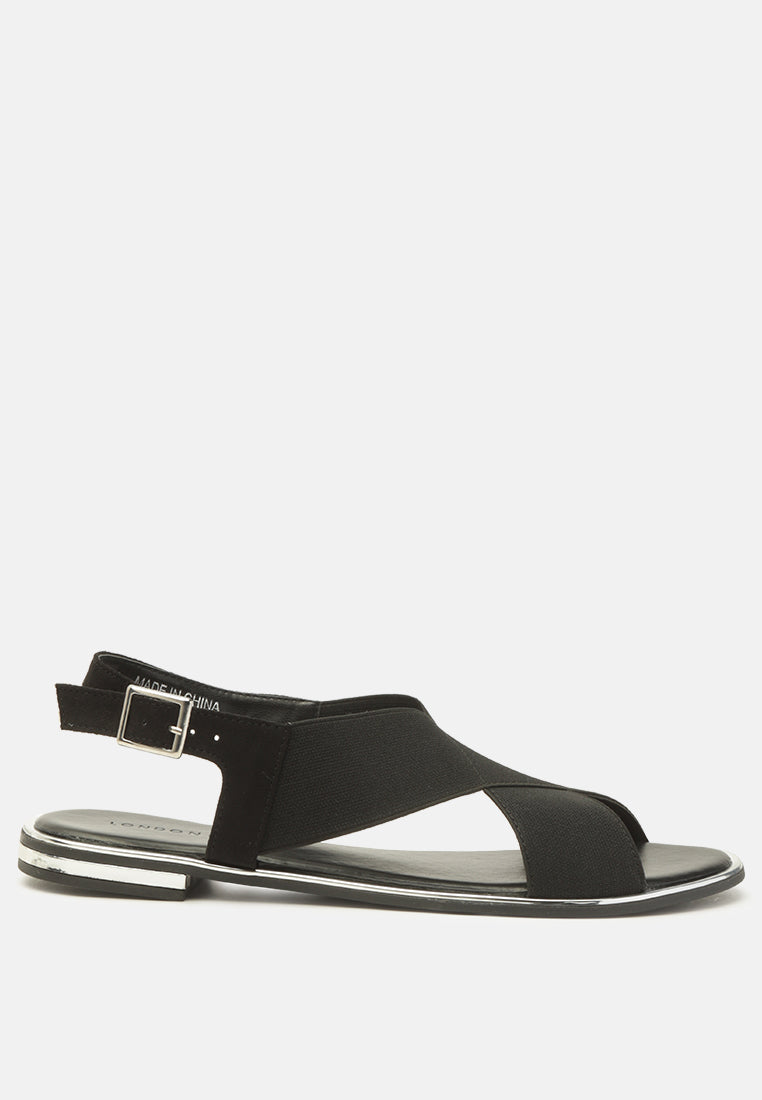 Snuggle Slingback Flat Sandals featuring a stylish cross strap design and a sleek base with silver lining.