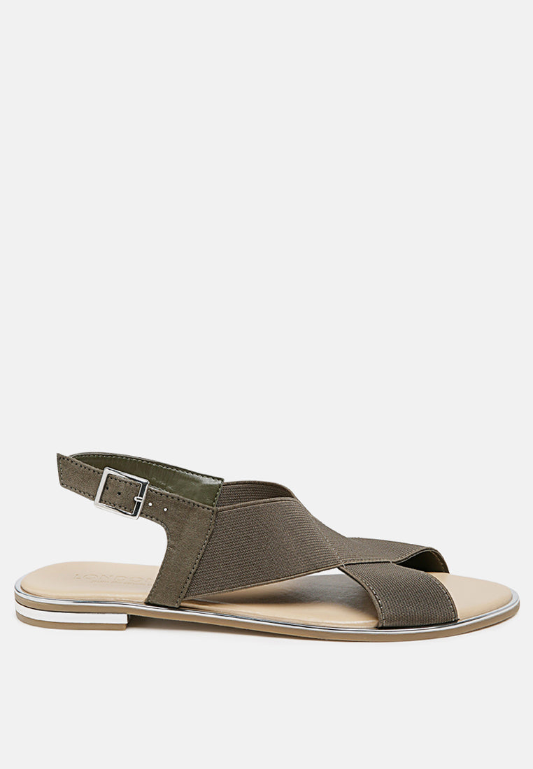 Snuggle Slingback Flat Sandals featuring a stylish cross strap design and a sleek base with silver lining.