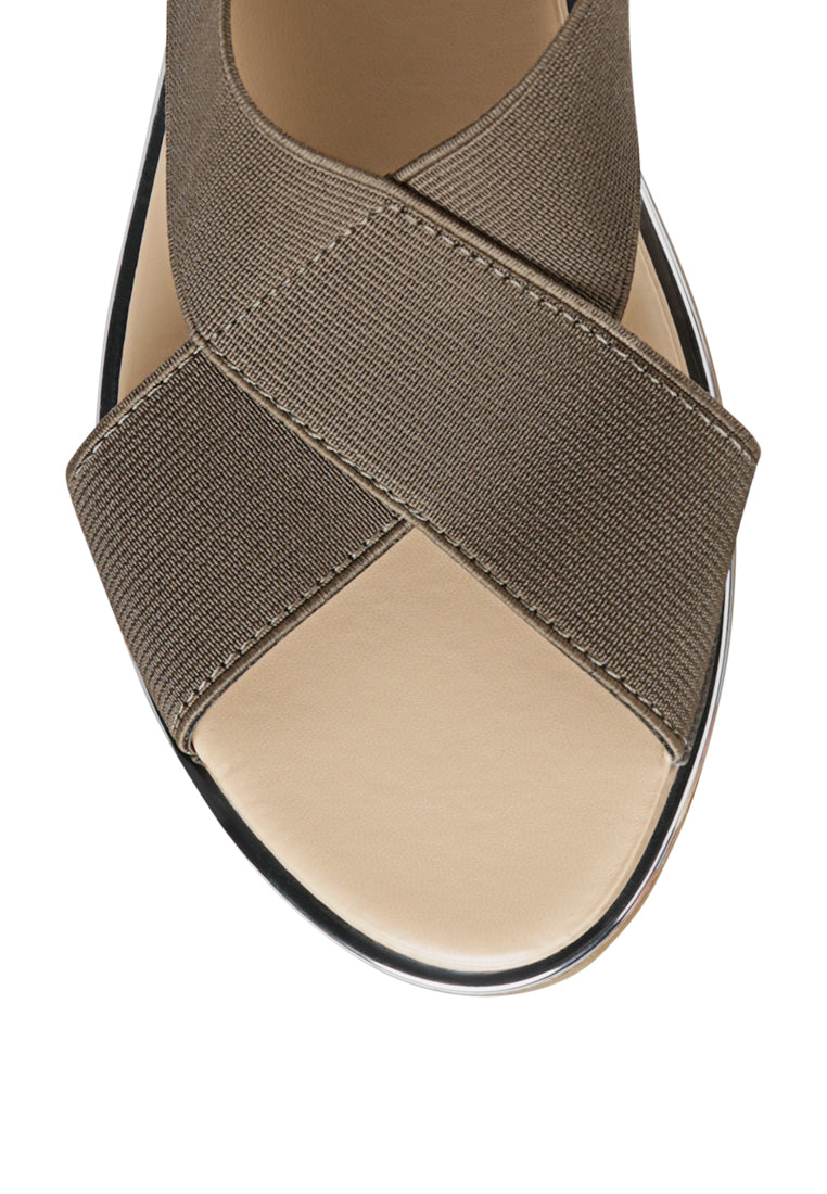 Snuggle Slingback Flat Sandals featuring a stylish cross strap design and a sleek base with silver lining.