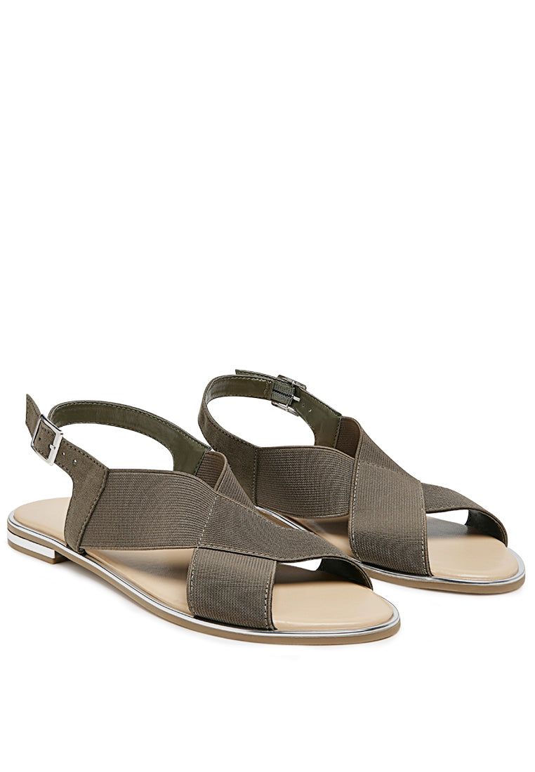 Snuggle Slingback Flat Sandals featuring a stylish cross strap design and a sleek base with silver lining.