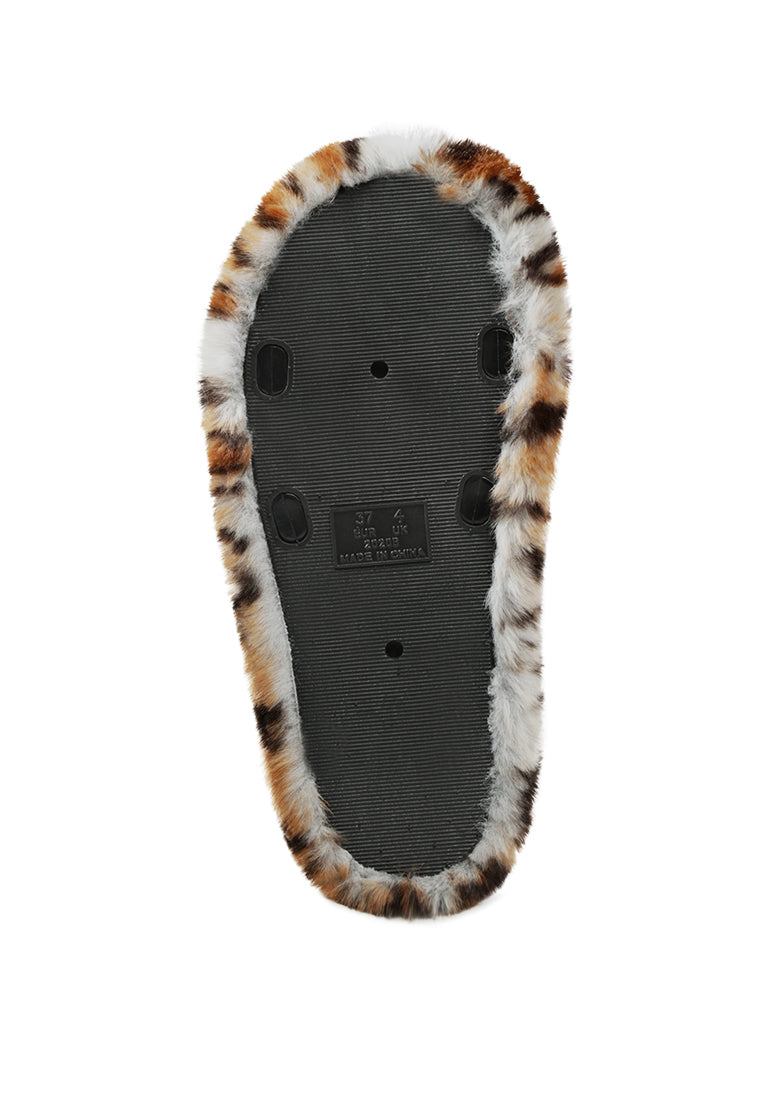 Snuggle-In Indoor Fur Flats showcasing soft faux fur material and open toe design, perfect for cozy indoor wear.