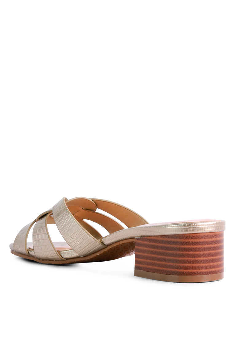 Sonnet Sandal featuring woven straps, low heel, and open toe design, perfect for casual summer wear.