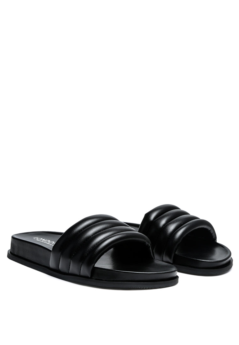 A pair of Sponge Quilted Pool Slides featuring a stylish quilted strap design, perfect for indoor and outdoor wear.