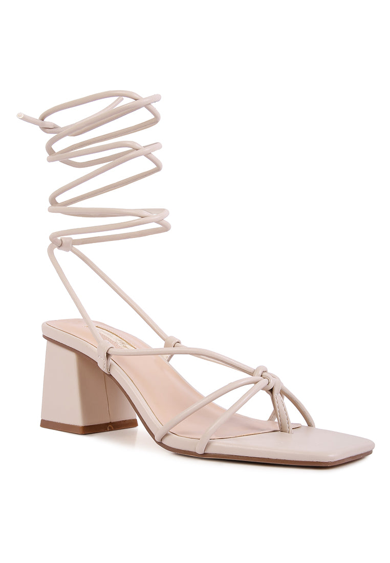 Spruce Dessert Sandal featuring square block heels and tie-up design in vibrant colors, perfect for summer wear.