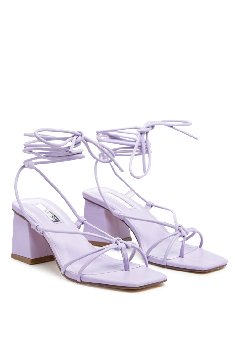 Spruce Dessert Sandal featuring square block heels and tie-up design in vibrant colors, perfect for summer wear.