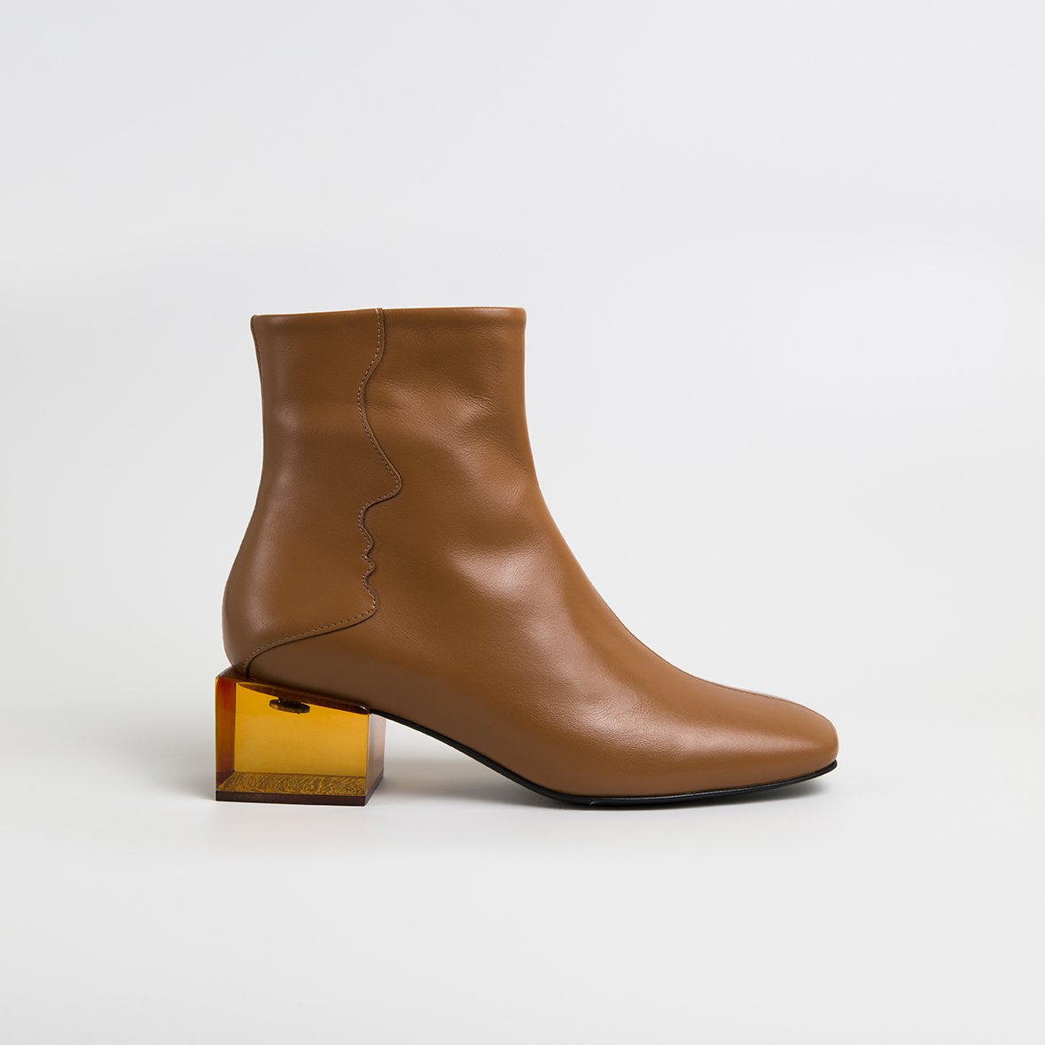 Stylish STATUETTE Camel Leather Boots with acrylic cube heel, showcasing premium craftsmanship and contemporary design.